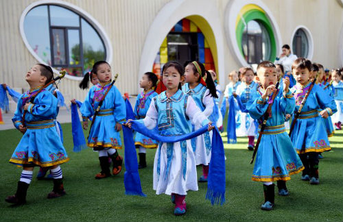 Children in ethnic Mongolian custom ready to perform on May 25.jpg