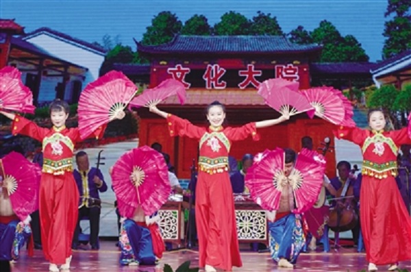 Farmers and herdsmen from Xishuimo Village of Yuquan district perform a fan dance in Hohhot, North China’s Inner Mongolia autonomous region, July 16.jpg