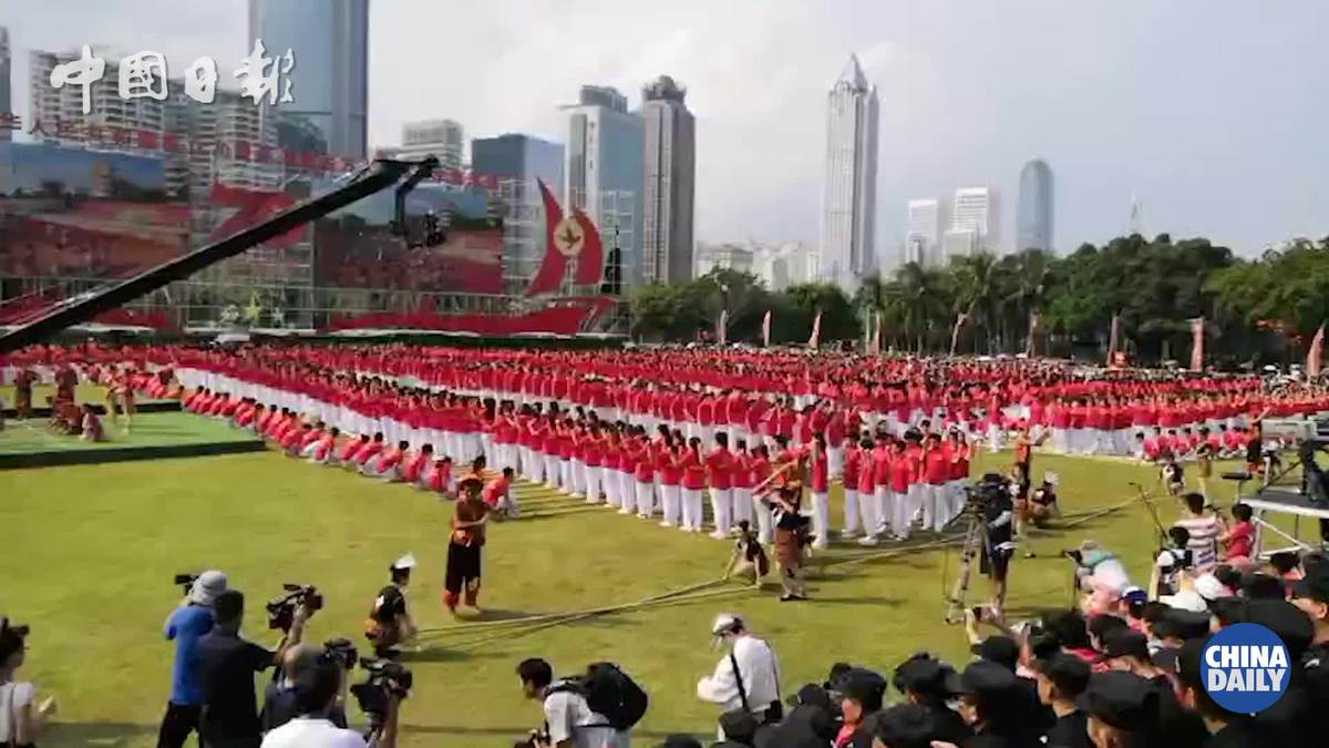 Hainan marks National Day with bamboo dancing