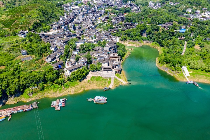 Green foliage blankets ancient town in C China