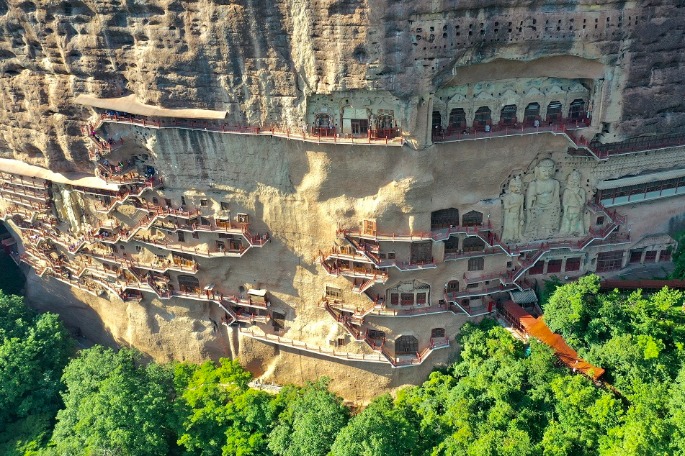 Grottos add immortal glamour to cliffs in NW China