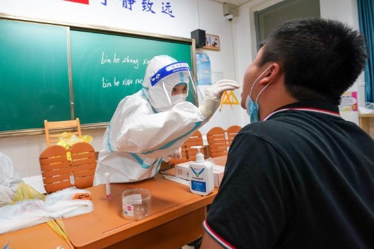 China mulls booster shots to step up herd immunity