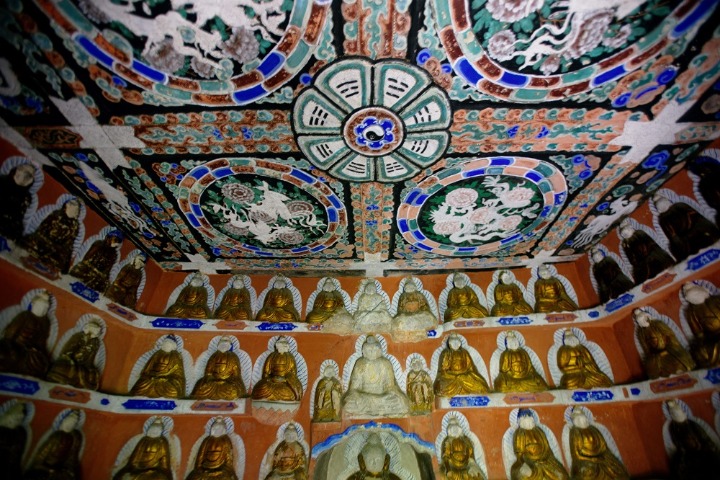 Ancient grottoes shine with immortal charm in the mountains