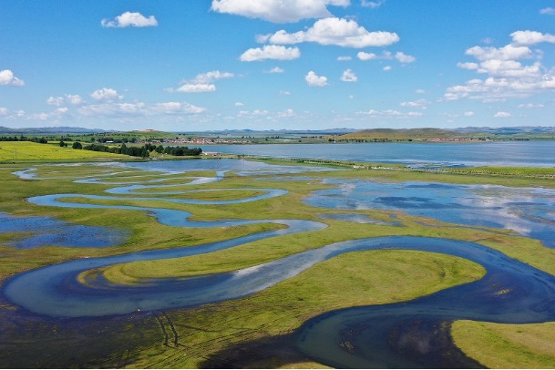 Winding river draws ecological painted scroll across grasslands