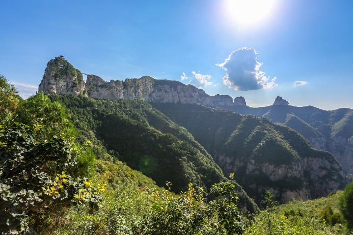 Eminent mountain exudes charms under blue sky