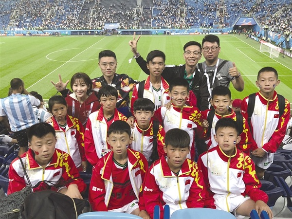 Young football fans pose for a photograph before the start of a World Cup match..jpg