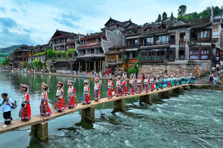 Miao people celebrate with traditional silver