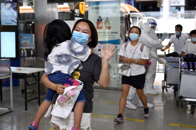 First group of tourists stranded in China's Sanya return home