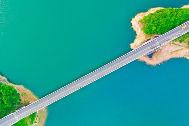 Aerial view of Jinzhai bridge across Meishan Reservoir in Anhui