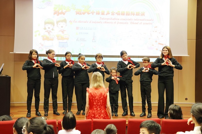 Sino-French youth sing to welcome Paris Olympic Games